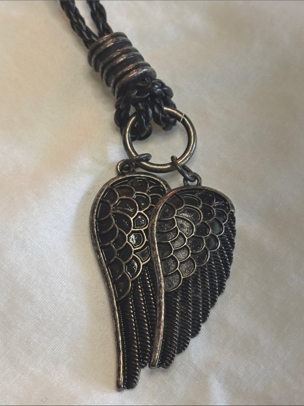 Guess Black Wing Pendant Necklace on Braided Cord